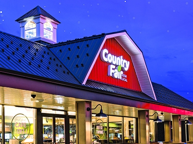 Country Fair store highlighting exterior store sign with starry sky.