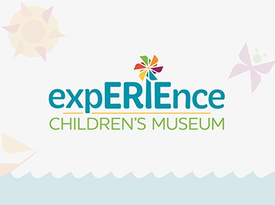 Erie Children's Museum logo over custom website illustrations