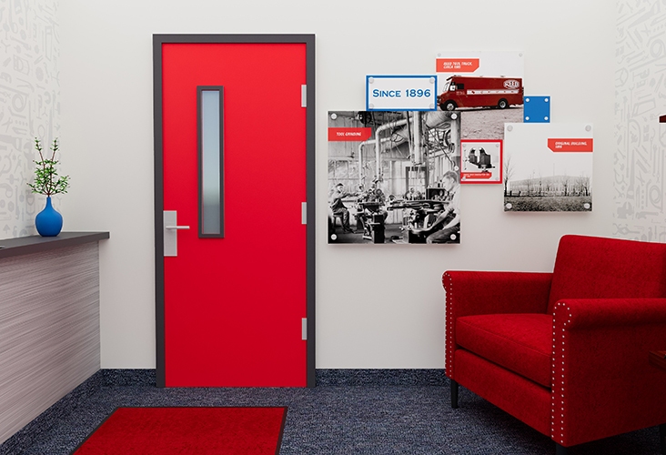 REED Manufacturing lobby with red door and 3D wall graphic