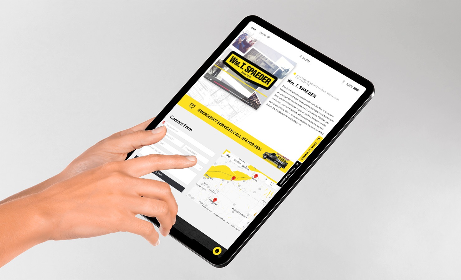 Wm. T. Spaeder website contact form displayed on iPad with user's hand selecting form fields.