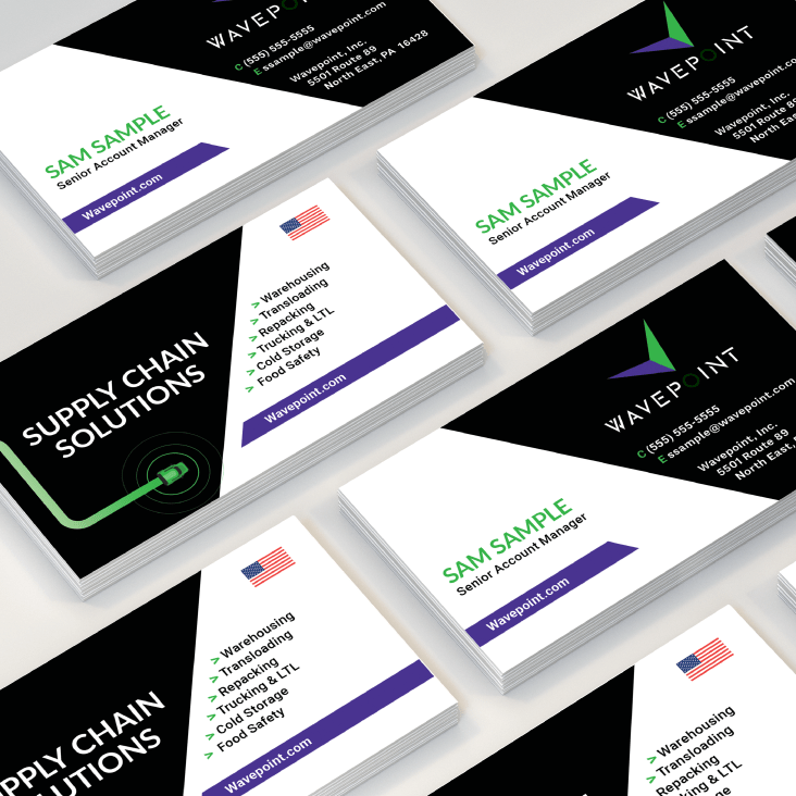 Wavepoint business cards on grey background.
